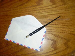 envelope and pen on table