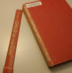 Book with original spine cloth detached