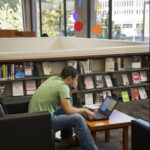 photo of student working in Dewey Library
