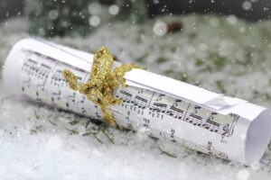 Rolled up sheet music in the falling snow