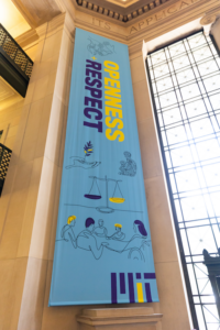 A banner in MIT's Lobby 7 reads "Openness and respect"