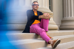 Peter Fisher on the steps of MIT's building at 77 Massachusetts Avenue