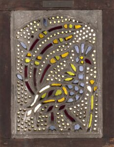 Stained glass window featuring a peacock design